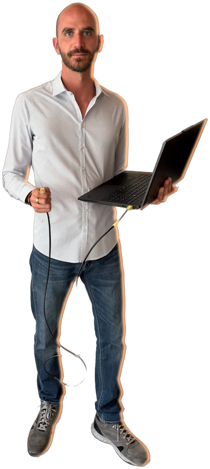 Andrea Marangione with his laptop connected to an industrial plant
